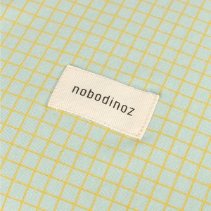 Colchón cambiador+funda 50x70cm STORIES Edición Limitada Nobodinoz green lemon grid