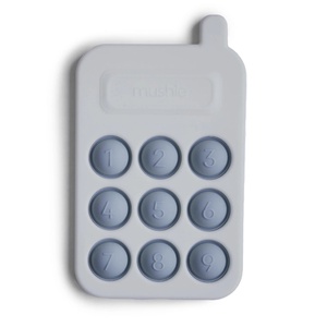 Juguete sensorial PRESS PHONE Mushie tradewinds