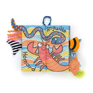Libro tela COUCOU MER Jellycat