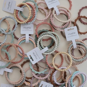Mordedor pulsera 3uds FLOWER Mushie cambridge blue-clementine-natural
